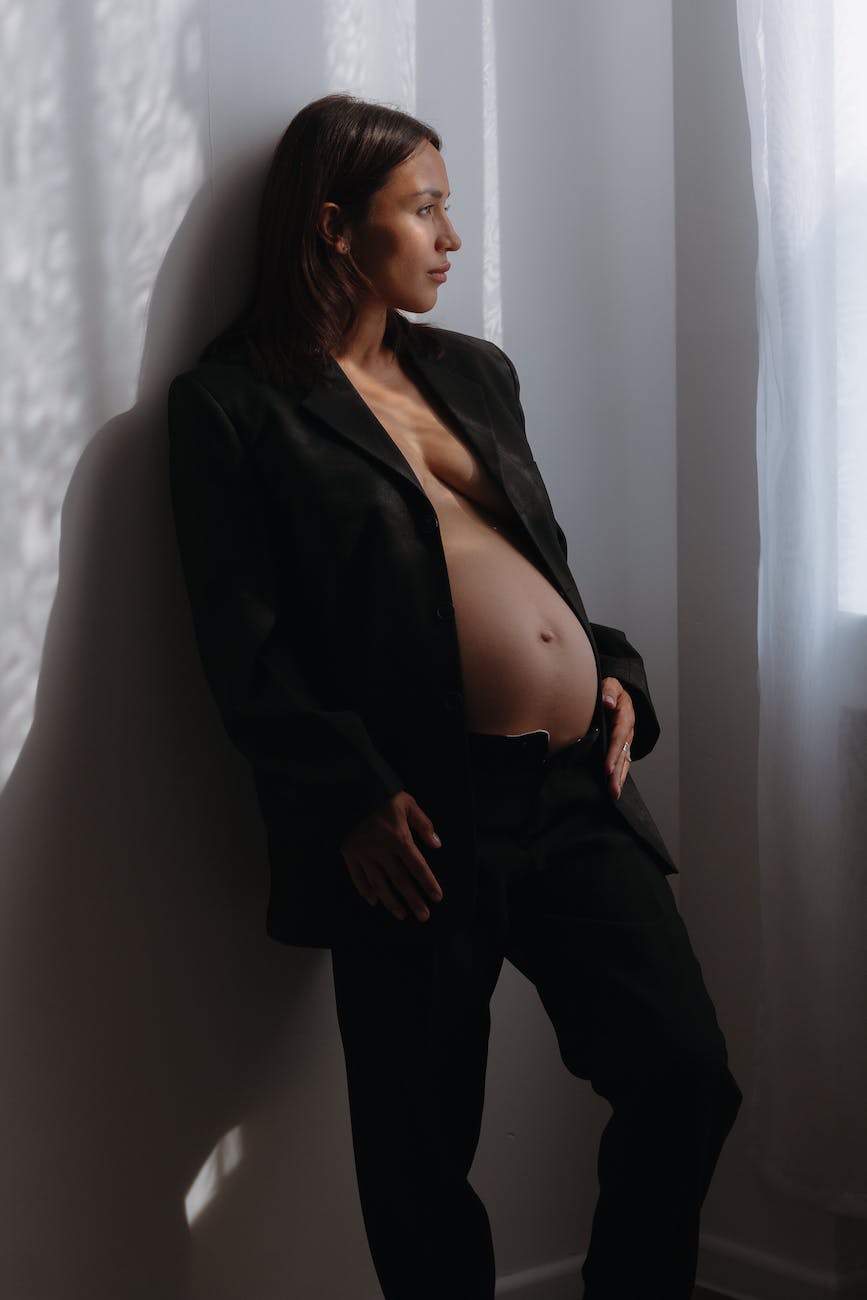 elegant pregnant woman posing at a pregnancy photoshoot