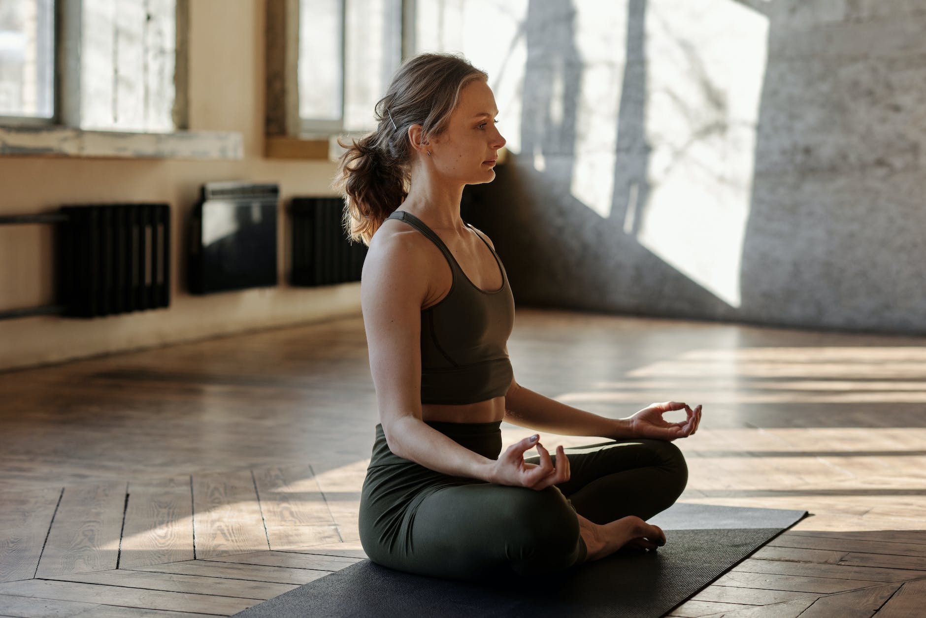 photo of woman in a yoga position